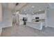Open concept kitchen with stainless steel appliances, island and modern light fixture at 5814 Stockport St, Riverview, FL 33578