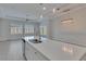 Modern kitchen island with stainless steel appliances, pendant lighting, and open layout at 5814 Stockport St, Riverview, FL 33578