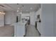 Open-concept kitchen featuring white cabinetry, stainless steel appliances, and a large center island at 5814 Stockport St, Riverview, FL 33578