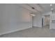 Large living room with modern light fixture and gray tile flooring throughout at 5814 Stockport St, Riverview, FL 33578