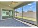 Screened patio with brick flooring and sliding glass doors for indoor/outdoor living at 5814 Stockport St, Riverview, FL 33578