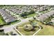 Aerial view of residential community with park and neatly arranged homes, perfect for families at 7869 Timberview Loop, Wesley Chapel, FL 33545