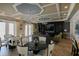 Elegant clubhouse interior featuring stylish seating, tables, a large TV, and sophisticated decor at 7869 Timberview Loop, Wesley Chapel, FL 33545