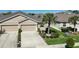 Newer construction paired villas with two-car garages, attractive landscaping and neutral color palettes at 7869 Timberview Loop, Wesley Chapel, FL 33545