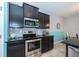 Close up of the kitchen featuring stainless steel appliances and stylish tile backsplash at 7869 Timberview Loop, Wesley Chapel, FL 33545
