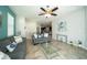 Comfortable living room featuring neutral wall paint, recessed lighting, comfortable couches, and a stylish glass coffee table at 7869 Timberview Loop, Wesley Chapel, FL 33545