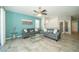 Bright living room featuring neutral wall paint, recessed lighting, comfortable couches, and lots of natural light at 7869 Timberview Loop, Wesley Chapel, FL 33545