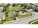 Well-maintained neighborhood park with playground, basketball court, and sidewalks at 7869 Timberview Loop, Wesley Chapel, FL 33545