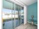 View of a lush green lawn from the sliding glass doors with an ADT security sticker on the door at 7869 Timberview Loop, Wesley Chapel, FL 33545