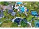 Aerial view of community with pools, tennis courts, playground, and clubhouse at 8420 Dunham Station Dr, Tampa, FL 33647