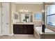 Bright bathroom with double vanity, soaking tub, and separate shower with glass enclosure at 8420 Dunham Station Dr, Tampa, FL 33647