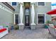 Charming front entrance with grand white pillars and outdoor seating area at 8420 Dunham Station Dr, Tampa, FL 33647