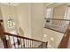 Light-filled foyer with staircase leading to a second floor overlook and chandelier at 8420 Dunham Station Dr, Tampa, FL 33647