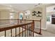 Bright and open second floor hallway, showing views from overlooking the staircase at 8420 Dunham Station Dr, Tampa, FL 33647