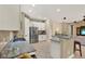 Spacious kitchen featuring granite countertops, stainless steel appliances, and tile flooring at 8420 Dunham Station Dr, Tampa, FL 33647