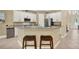 Bright kitchen with granite countertops, stainless steel appliances, and stylish bar stool seating at 8420 Dunham Station Dr, Tampa, FL 33647