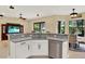 Kitchen island with granite countertops and stainless steel appliances overlooking the dining area at 8420 Dunham Station Dr, Tampa, FL 33647