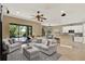 Open-concept home showcasing tile floors, stylish furniture, and sliding glass doors to backyard pool at 8420 Dunham Station Dr, Tampa, FL 33647