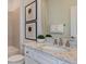 Elegant bathroom features double sinks, granite countertops, and modern fixtures at 9740 Redwood Heights Loop, Thonotosassa, FL 33592