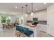 Bright kitchen with granite countertops, pendant lighting, stainless steel appliances, and an adjacent dining area at 9740 Redwood Heights Loop, Thonotosassa, FL 33592