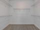 Spacious walk-in closet with ample shelving for optimal storage and organization at 9740 Redwood Heights Loop, Thonotosassa, FL 33592