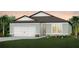 Charming single-Gathering home features a well-manicured lawn, inviting entryway, and a two-car garage at 9747 Redwood Heights Loop, Thonotosassa, FL 33592