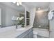 Bathroom featuring a marble countertop, shower, and bathtub with grey colored tile at 9754 Redwood Heights Loop, Thonotosassa, FL 33592