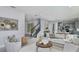 Bright, open-concept living room flowing into kitchen with modern decor and fixtures at 9754 Redwood Heights Loop, Thonotosassa, FL 33592