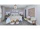 Stylish main bedroom with neutral tones, decorative lighting and carpeted floor at 9754 Redwood Heights Loop, Thonotosassa, FL 33592