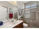 Well-lit bathroom boasts a glass-enclosed shower and stylish vanity with a marble countertop at 9916 Preakness Stakes Way, Dade City, FL 33525