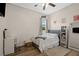 Bedroom with hardwood floors, neutral walls, a bed, and a desk area at 9916 Preakness Stakes Way, Dade City, FL 33525