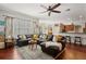 Bright, open-concept living area with comfortable seating, connecting to the kitchen area at 9916 Preakness Stakes Way, Dade City, FL 33525