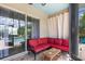 Enclosed patio offering a relaxing space with comfortable seating near the sparkling swimming pool at 9916 Preakness Stakes Way, Dade City, FL 33525