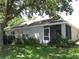 Spacious backyard featuring a screened in lanai and lush landscaping at 19232 Barred Owl Ct, Land O Lakes, FL 34638
