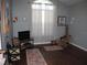 Cozy living space with large windows, hardwood floors, and comfortable seating at 19232 Barred Owl Ct, Land O Lakes, FL 34638