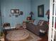 Comfortable living room with cozy seating, decor and natural lighting at 19232 Barred Owl Ct, Land O Lakes, FL 34638