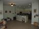 Open-concept living area flowing into the kitchen with ample seating at 19232 Barred Owl Ct, Land O Lakes, FL 34638