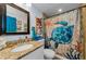 Charming bathroom with a granite vanity, decorative mirror, and whimsical turtle-themed shower curtain, creating a unique touch at 4252 Sheldon Pl # 4252, New Port Richey, FL 34652
