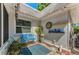 Picturesque courtyard with a blue bench, vibrant plants, and decorative accents, offering a tranquil and inviting outdoor space at 4252 Sheldon Pl # 4252, New Port Richey, FL 34652