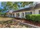 Charming single-story home featuring a well-maintained lawn, mulch beds, and decorative shutters enhancing curb appeal at 4252 Sheldon Pl # 4252, New Port Richey, FL 34652
