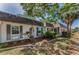 Charming single-story home showcasing decorative mulch beds, shutters, and a palm tree to enhance curb appeal at 4252 Sheldon Pl # 4252, New Port Richey, FL 34652