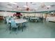 Bright gathering room features ample seating, a fireplace, and an adjacent outdoor area at 4252 Sheldon Pl # 0, New Port Richey, FL 34652