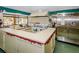 Functional kitchen area with appliances, counter space, and natural light, perfect for community events at 4252 Sheldon Pl # 4252, New Port Richey, FL 34652