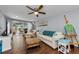 Bright living room with wood floors, ceiling fan, and sliding doors to the patio at 4252 Sheldon Pl # 4252, New Port Richey, FL 34652
