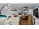 Cozy living room features a white sofa, wood floors, and beach-themed decor at 4252 Sheldon Pl # 4252, New Port Richey, FL 34652