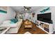 Relaxing living room with comfortable seating, wood floors, and a ceiling fan at 4252 Sheldon Pl # 4252, New Port Richey, FL 34652