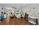 The spacious living room features wood floors and access to the outdoor patio at 4252 Sheldon Pl # 4252, New Port Richey, FL 34652