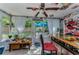 Bright patio with a ceiling fan, bar, and sliding doors to the backyard at 4252 Sheldon Pl # 4252, New Port Richey, FL 34652