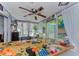 This patio is decorated with a fan, plants and a unique sticker-covered counter at 4252 Sheldon Pl # 4252, New Port Richey, FL 34652