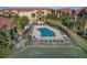 Aerial view of a pool area with shuffleboard courts in the complex at 10764 70Th Ave # 1205, Seminole, FL 33772
